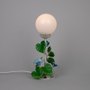 Hand painted table lamp with blue flowers, green leaves and an opaline globe from France 1950s