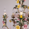 floral chandelier with ceramic roses and pink teardrop icicles. The roses and icicles are handmade in Italy. The chandelier is from the 1950s