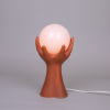 Ceramic hands lamp dark orange hand table lamp with glass globe art deco sculpture